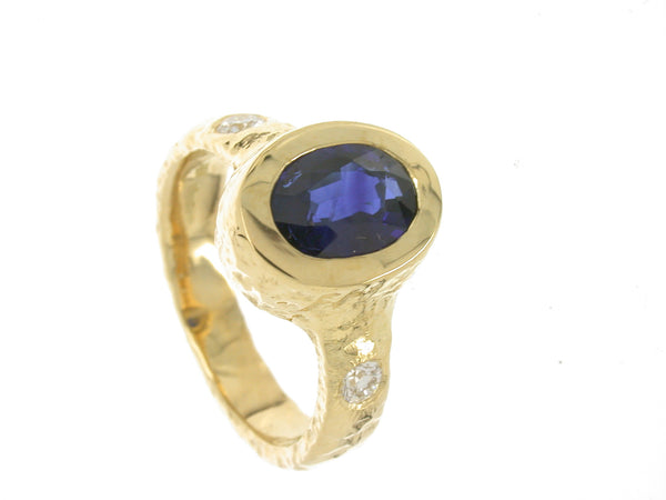 Sapphire and diamond ring handmade in 18ct yellow gold.