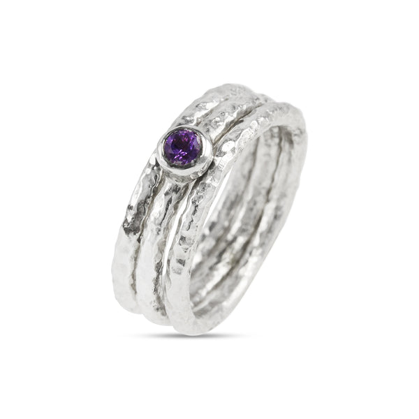 Handcrafted silver stacking rings set with an amethyst. - paul magen