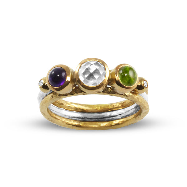 Handmade ring in 18ct and silver set blue topaz amethyst and peridot.