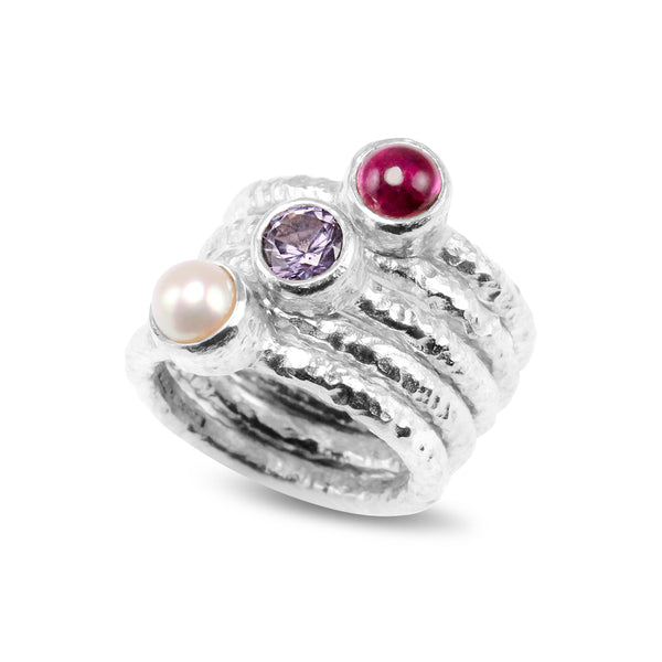 Silver stacking rings set with pearl pink tourmaline and alexandrite.