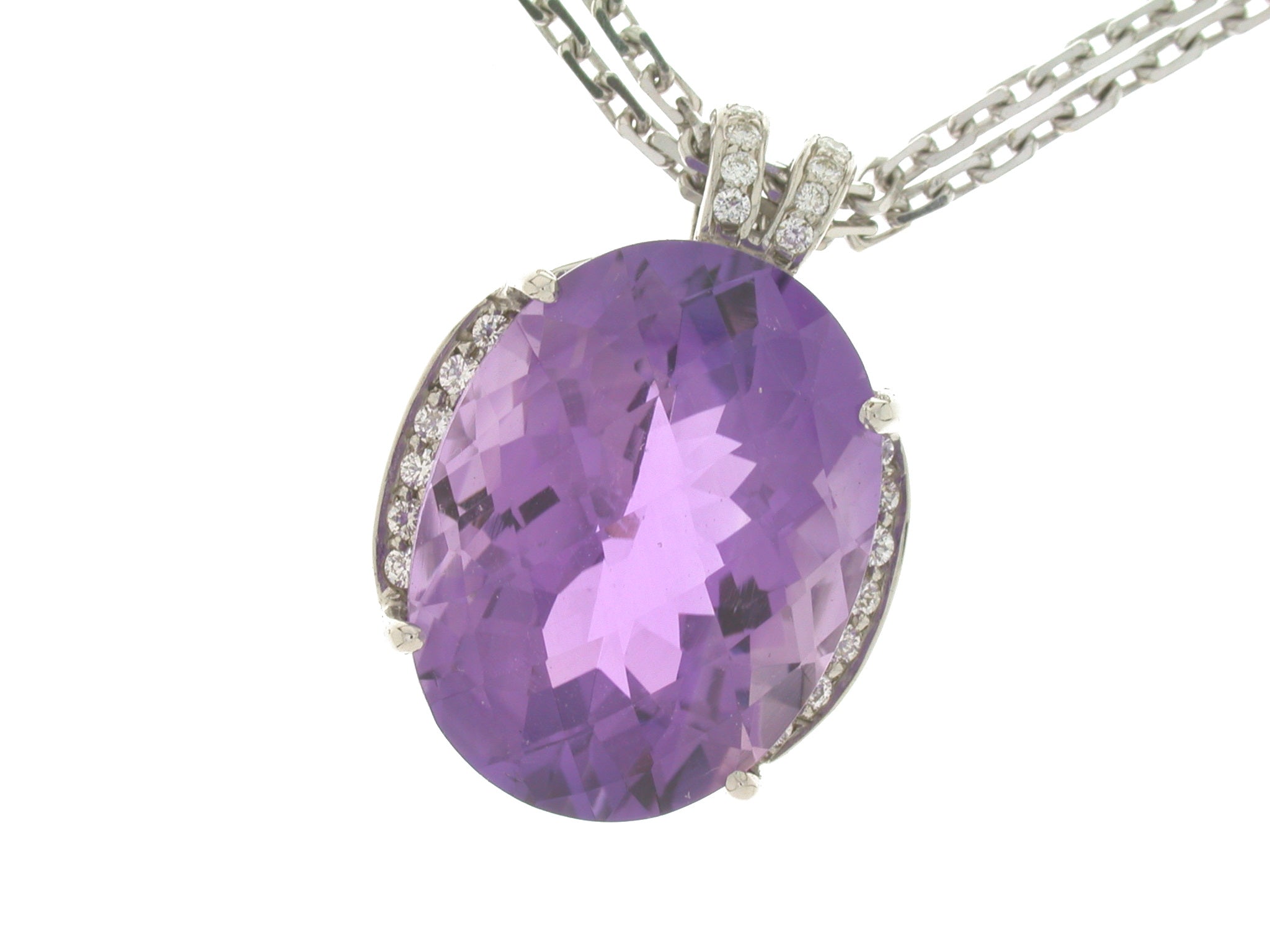 Amethyst and diamond statement pendant handmade in white gold.