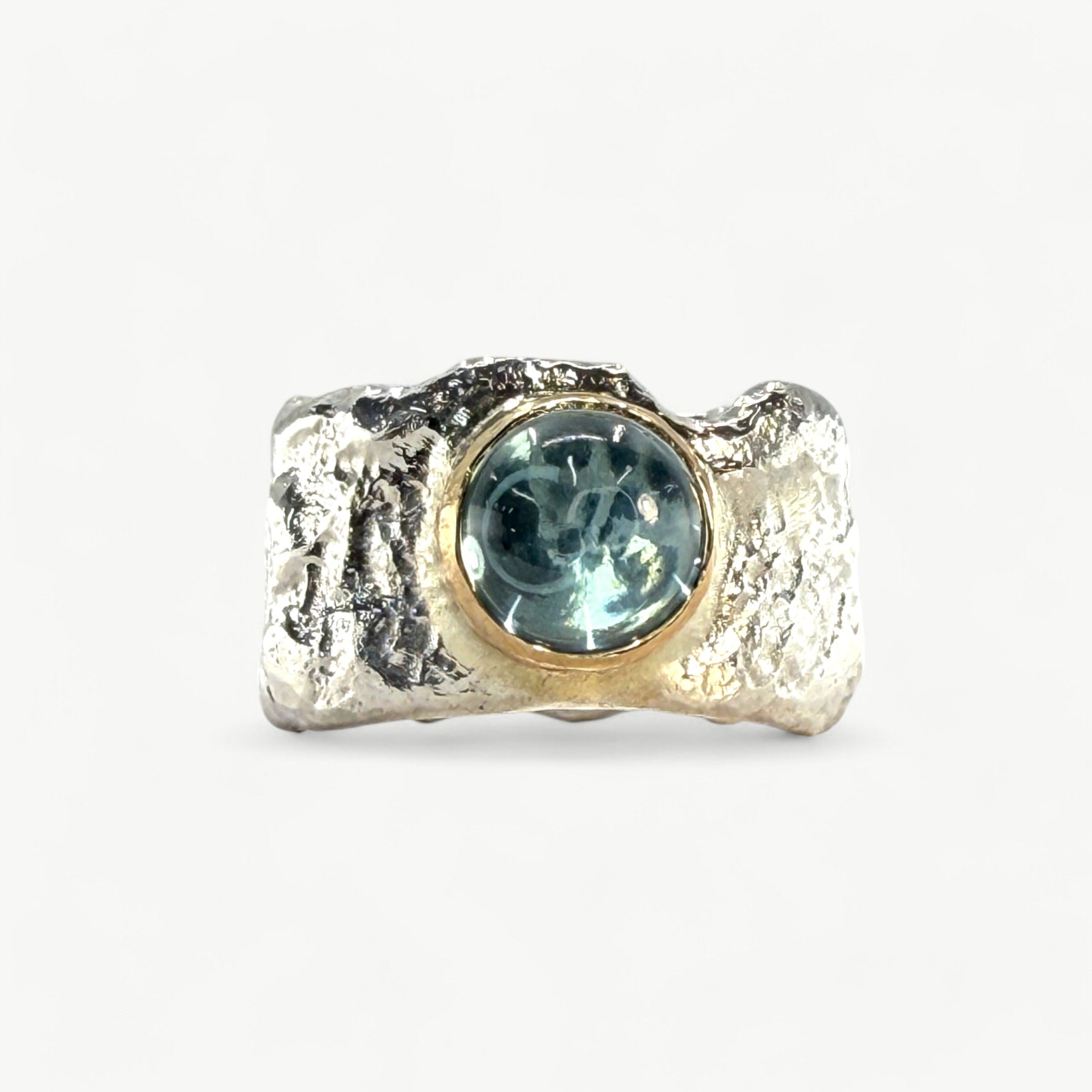 Cabochon blue topaz set in 18ct gold