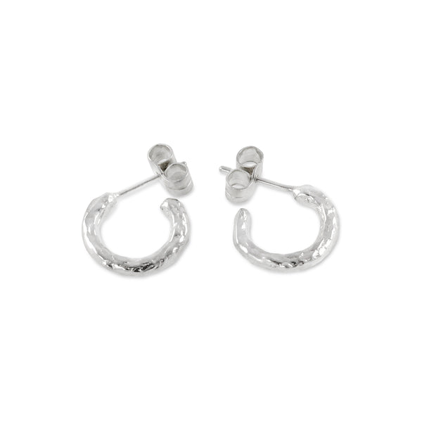 Contemporary hand textured hoop earrings made in silver. - paul magen