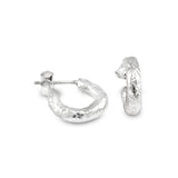 Contemporary hand textured hoop earrings made in silver. - paul magen