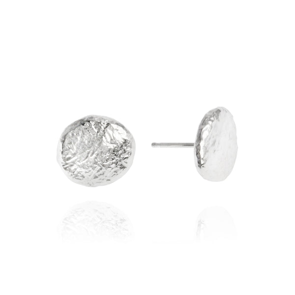 Earrings in silver with a hand textured finish. - paul magen