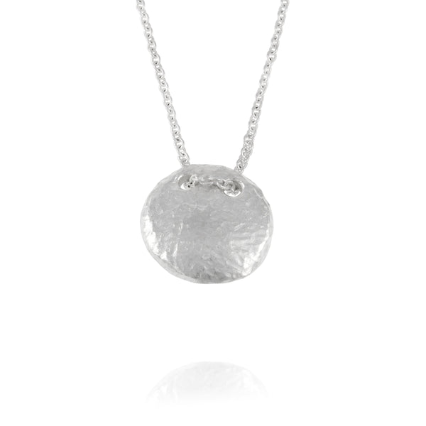 Handmade pendant with a texture in silver on a chain. - paul magen