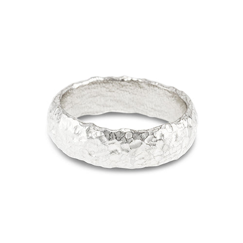 Silver D shaped rings handmade with an organic texture. - paul magen