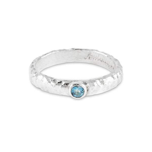 Handmade blue topaz ring in silver with an organic texture. - paul magen