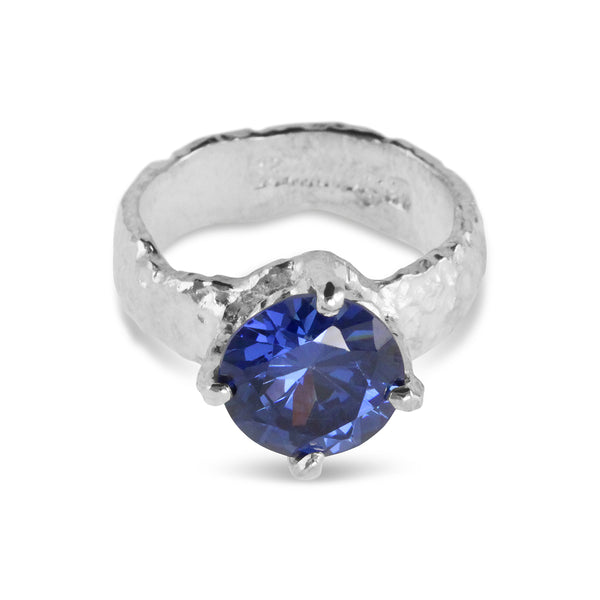 Silver ring set with blue cubic zirconia stone. - paul magen