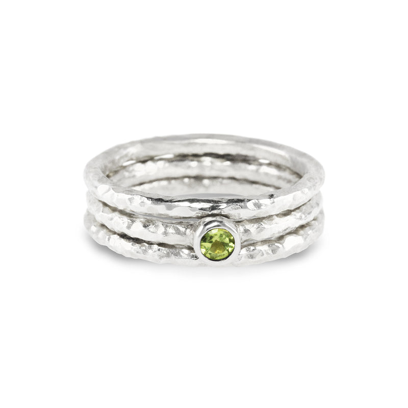 Stacking rings handmade in silver set with a peridot. - paul magen