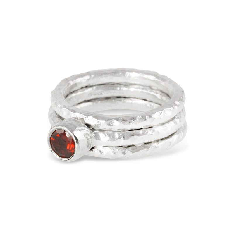 Handmade stacking silver rings set with a garnet. - paul magen