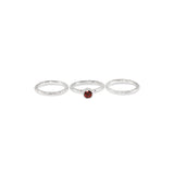 Handmade stacking silver rings set with a garnet. - paul magen