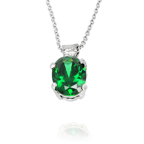 Silver pendant set with green cubic zirconia on a necklace. - paul magen
