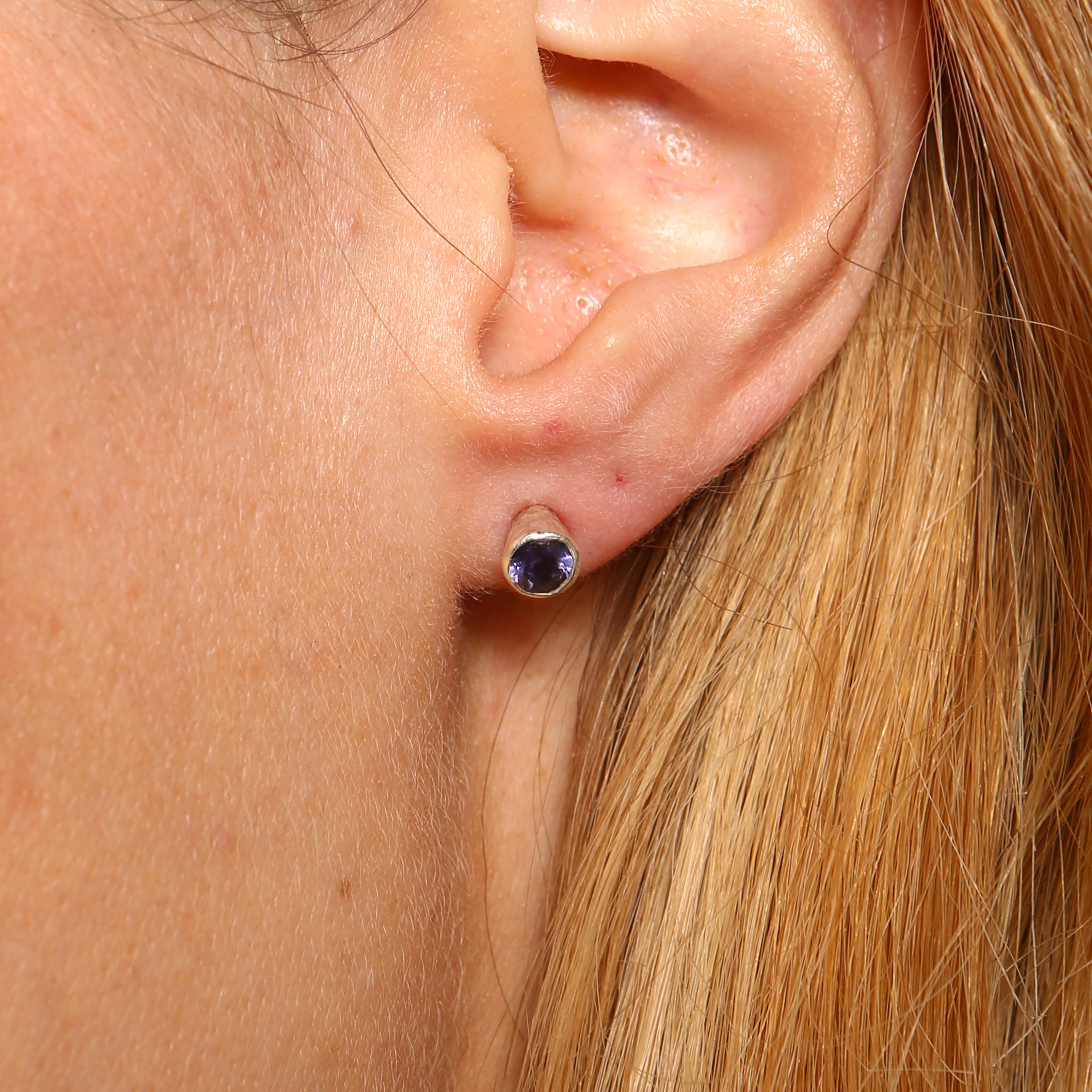 Handmade stud earrings in silver set with an amethyst. - paul magen